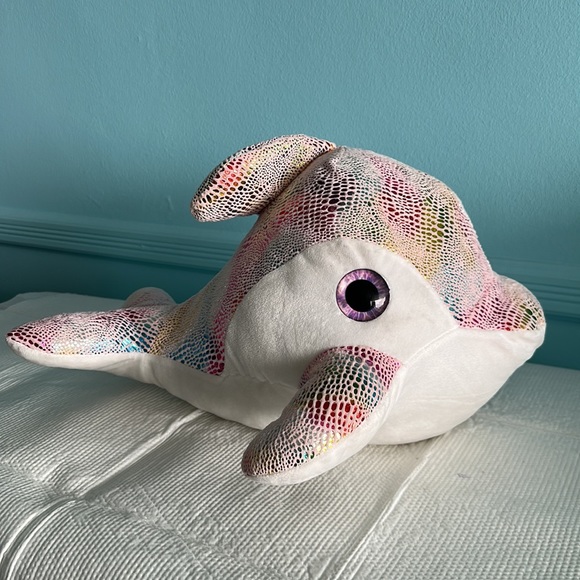 I am selling a cute dolphin, plushy toy with a shiny fins and back fin and tail - Picture 2 of 2